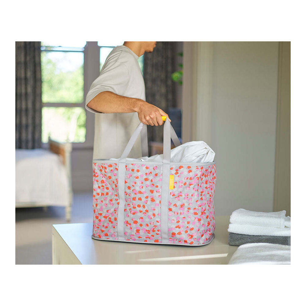 50040-joseph-joseph-hold-all-max-53cm-55l-laundry-basket-peach-blossom