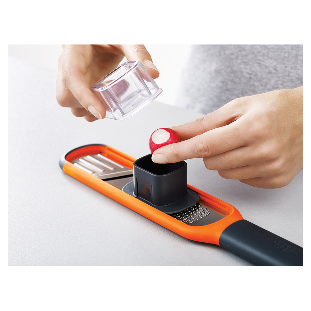 20048-joseph-joseph-handi-grate-2-in-1-mini-grater-and-slicer-orange