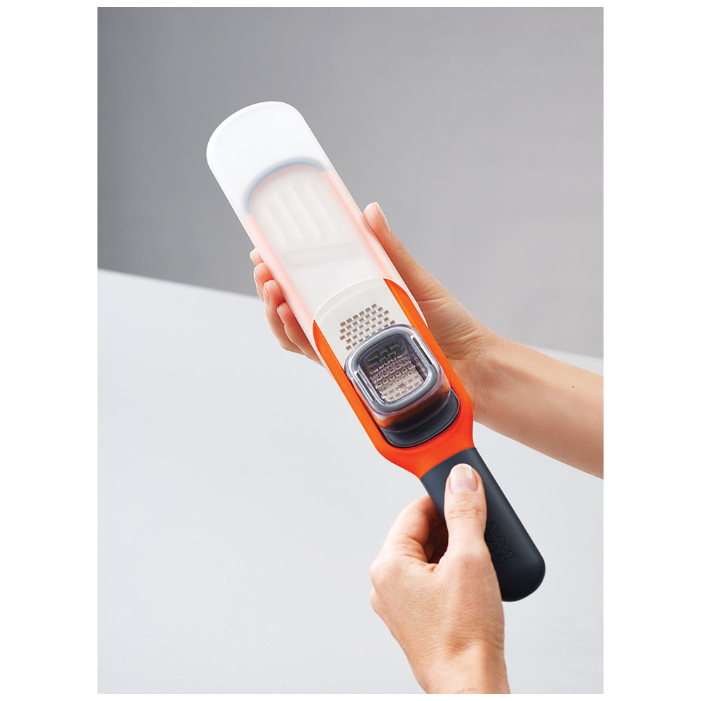 20048-joseph-joseph-handi-grate-2-in-1-mini-grater-and-slicer-orange